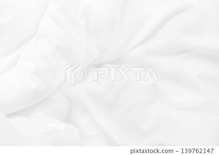 Close up top view of white bedding sheet and wrinkle messy blanket in bedroom after wake up in the morning. 139762147