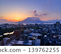 [Kagoshima Prefecture] Sakurajima volcano at sunrise and the cityscape of Kagoshima City 139762255