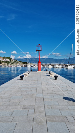 Red Lighthouse on Stone Pier in Baska Red Lighthouse on Stone Pier in Baska 139762412