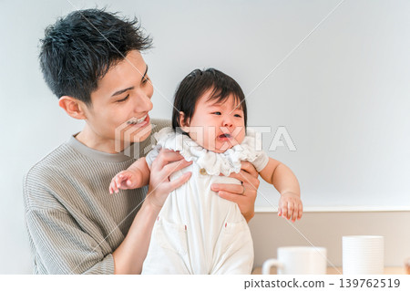 Father soothing a crying, fussy baby Father soothing a crying, fussy baby 139762519