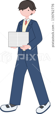 A male student in winter clothes carrying printouts. 139762776