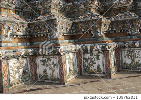 Wat Arun, Bangkok, Thailand: Ceramic decorations on the large stupa. Wat Arun, Bangkok, Thailand: Ceramic decorations on the large stupa. 139762811