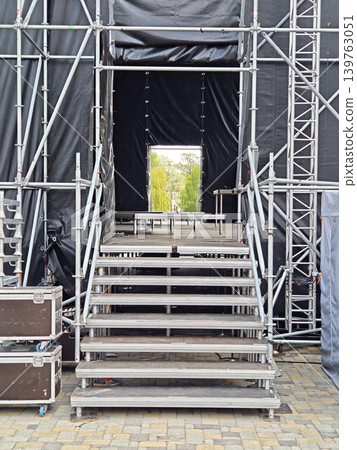 Rear view of a stage construction with metal stairs Rear view of a stage construction with metal stairs 139763051