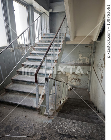 Dusty concrete stairwell in an abandoned building Dusty concrete stairwell in an abandoned building 139763061