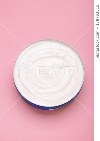 Jar of cream on pink background. Vertical photo Jar of cream on pink background. Vertical photo 139763318