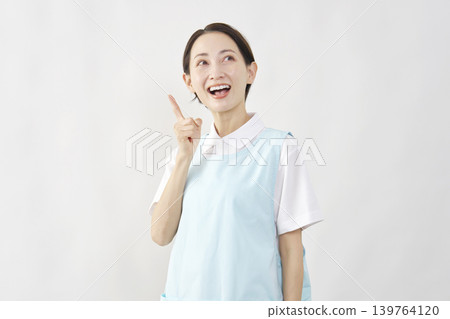 Female caregiver has an idea (white background) Female caregiver has an idea (white background) 139764120