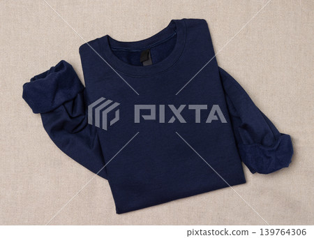 Blank dark blue unisex sweatshirt mockup, folded apparel flat lay with copy space, top view 139764306