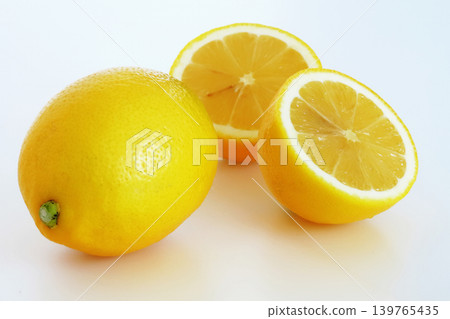Fresh, juicy, healthy, in-season lemons, half-cut and whole. Fresh, juicy, healthy, in-season lemons, half-cut and whole. 139765435