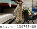 Senior woman is talking on phone and shopping for construction supplies in hardware store 139765489