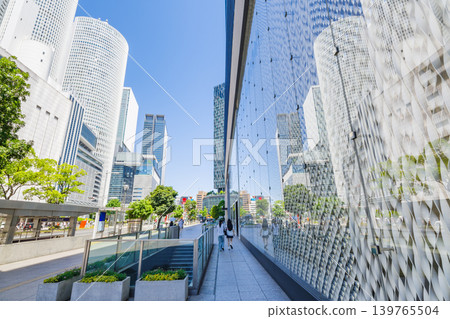 A cityscape featuring the glass walls of modern architecture against a clear blue sky (Nagoya Station, Nagoya City) A cityscape featuring the glass walls of modern architecture against a clear blue sky (Nagoya Station, Nagoya City) 139765504