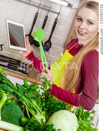 Woman having green vegetables thinking about cooking 139765558