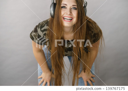 Teen women wearing headphones Teen women wearing headphones 139767175
