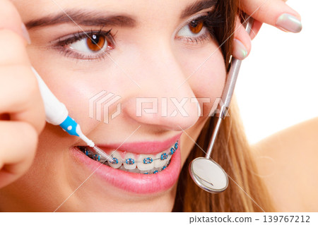 Woman with braces having dentist appointment Woman with braces having dentist appointment 139767212