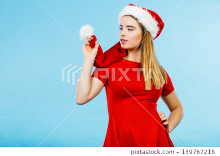 Woman wearing Santa Claus helper costume Woman wearing Santa Claus helper costume 139767218