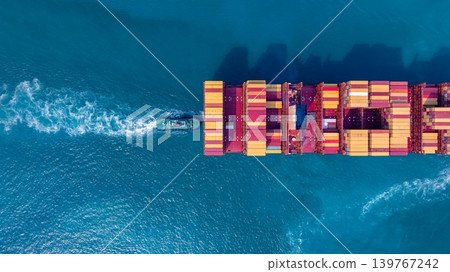 Container ship carrying container for import and export freight, Global business logistic and transportation by container ship boat in open sea, Aerial view container cargo freight ship. Container ship carrying container for import and export freight, Global business logistic and transportation by container ship boat in open sea, Aerial view container cargo freight ship. 139767242