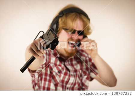 Gamer man shooting from gun 139767282