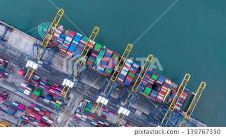 Container ship carrying container box in import export with quay crane, Global business cargo freight shipping commercial trade logistic and transportation oversea worldwide by container vessel. 139767350
