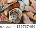 A close-up of grilled seafood, featuring fresh scallops and fish roe, cooked to perfection. 139767464