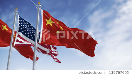 National flags of China and the United States waving in the wind on a clear day 139767605