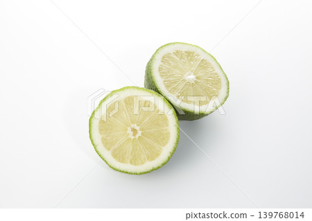 A sliced lime placed against a white background. A sliced lime placed against a white background. 139768014