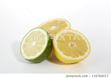 Freshly cut limes and lemons placed against a white background. Freshly cut limes and lemons placed against a white background. 139768017