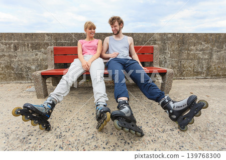 Young people friends relaxing on bench. Young people friends relaxing on bench. 139768300