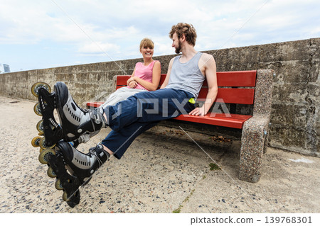 Young people friends relaxing on bench. Young people friends relaxing on bench. 139768301