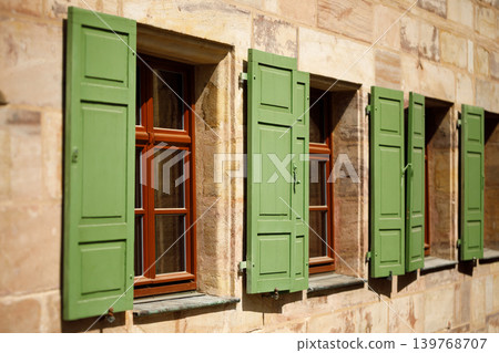 Traditional Stone House Windows with Green Wooden Shutters, Rustic Architecture Traditional Stone House Windows with Green Wooden Shutters, Rustic Architecture 139768707