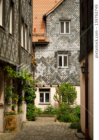 Colorful Historic House with Traditional Tile Facade on Narrow Old Town Street in Fuerth, Bavaria, Germany - Medieval European Architecture Colorful Historic House with Traditional Tile Facade on Narrow Old Town Street in Fuerth, Bavaria, Germany - Medieval European Architecture 139768749