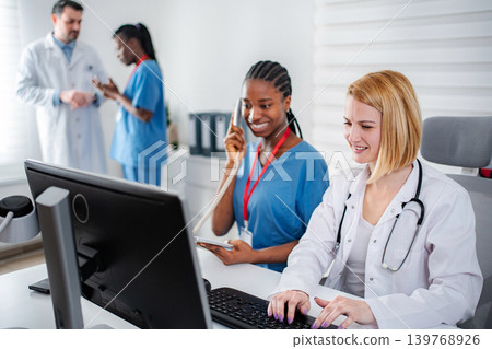 Medical team collaborating in office providing healthcare services Medical team collaborating in office providing healthcare services 139768926
