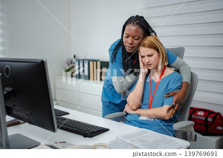 Healthcare worker experiencing stress and burnout receiving support from colleague Healthcare worker experiencing stress and burnout receiving support from colleague 139769691