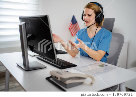 Nurse wearing headset making video call telemedicine appointment Nurse wearing headset making video call telemedicine appointment 139769721