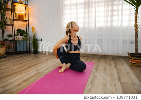 Mindful yoga practice in a cozy living space 139771031