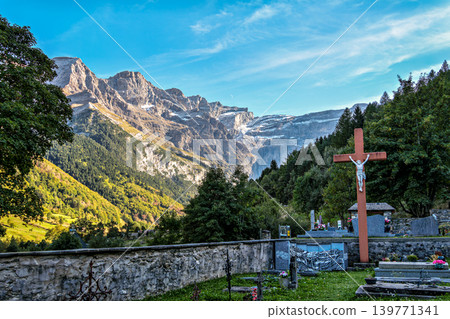 The church Notre Dame du Bon Port with cemetery in the mountain village Gavarnie-Gedre in Hautes-Pyrenees, France. 139771341
