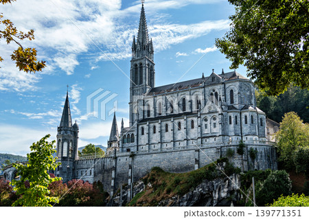 View of the Basilica in the Sanctuary of Lourdes, France. Mayor pilgrimage spot for Catholics View of the Basilica in the Sanctuary of Lourdes, France. Mayor pilgrimage spot for Catholics 139771351