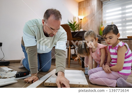 Engaging children in home improvement projects during the weekend Engaging children in home improvement projects during the weekend 139771634