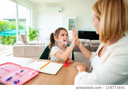 Joyful moments shared between a child and an adult Joyful moments shared between a child and an adult 139771691