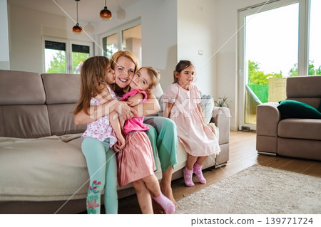 Joyful moments shared by a family in a cozy living room Joyful moments shared by a family in a cozy living room 139771724