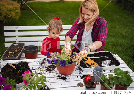 Gardening fun with little hands on a sunny afternoon Gardening fun with little hands on a sunny afternoon 139771799