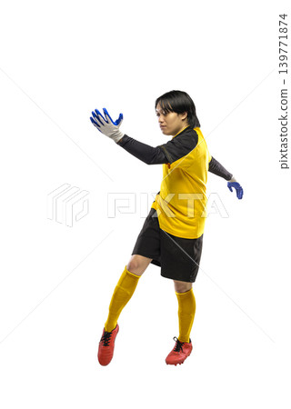 A professional Indonesian southeast asian soccer goalkeeper in a yellow jersey and black shorts leaps through the air to catch an invisible ball, isolated on a white background A professional Indonesian southeast asian soccer goalkeeper in a yellow jersey and black shorts leaps through the air to catch an invisible ball, isolated on a white background 139771874