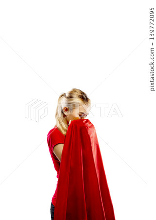 Young blonde Indonesian southeast asian woman in red shirt holding and kissing a large red fabric or flag, expressing emotion or patriotism, isolated on white background Young blonde Indonesian southeast asian woman in red shirt holding and kissing a large red fabric or flag, expressing emotion or patriotism, isolated on white background 139772095