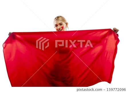 A happy young Indonesian southeast asian woman with red face paint holding a large blank red banner, isolated on white. Ideal for sports fans, national holidays, or advertising templates 139772096