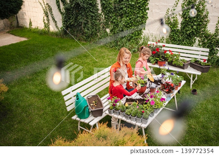 Gardening day with family in a bright green garden 139772354