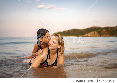 Mother and daughter enjoying summer vacation on Greece beach 139772495