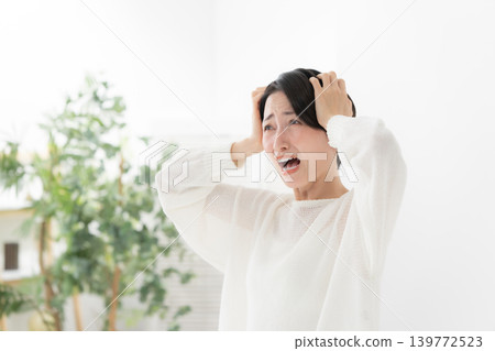 A woman holding a head A woman holding a head 139772523