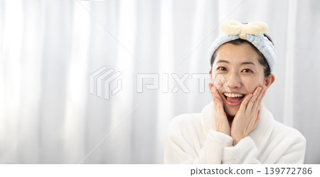 Smiling woman doing skin care Smiling woman doing skin care 139772786