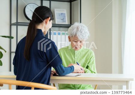 Senior woman consulting with care manager Senior woman consulting with care manager 139773464