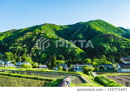 Peaceful rural landscapes and mountains in fresh greenery 139773497