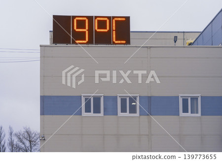 Minimalist municipal building with overcast sky and crisp winter sunlight illuminating facade Minimalist municipal building with overcast sky and crisp winter sunlight illuminating facade 139773655