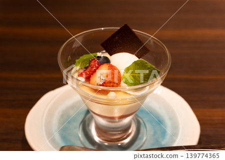A fruit parfait topped with delicious strawberries A fruit parfait topped with delicious strawberries 139774365